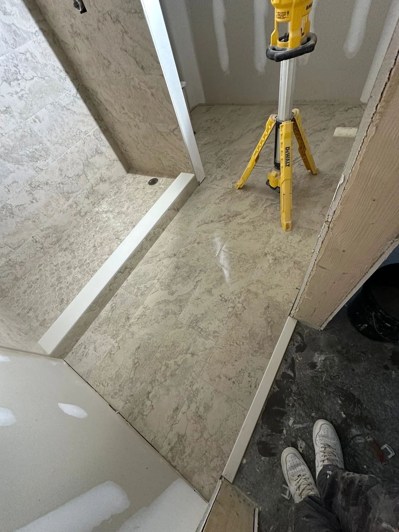 Real shower tile installation in progress